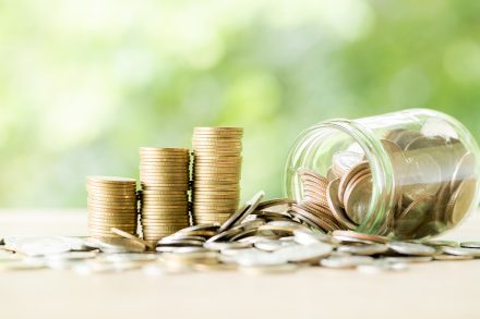 coin on wooden table scaled